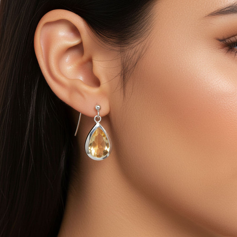 Faceted Pear Shape Citrine Earrings On Ear