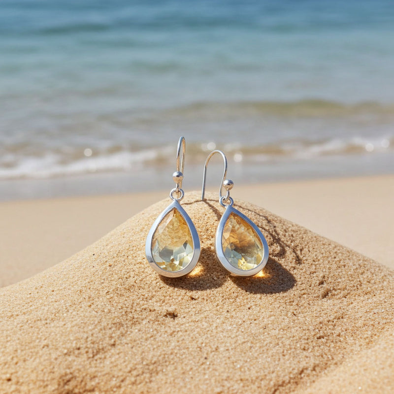 Faceted Pear Shape Citrine Earrings on Beach Display