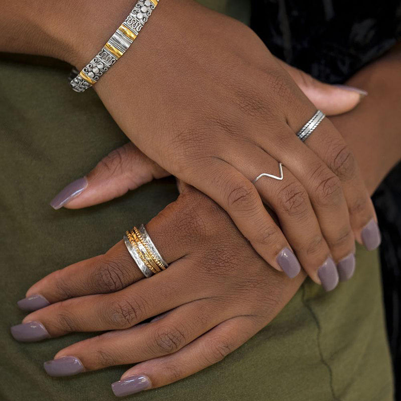 Hammered Silver and Gold Band Spin Ring On Hand