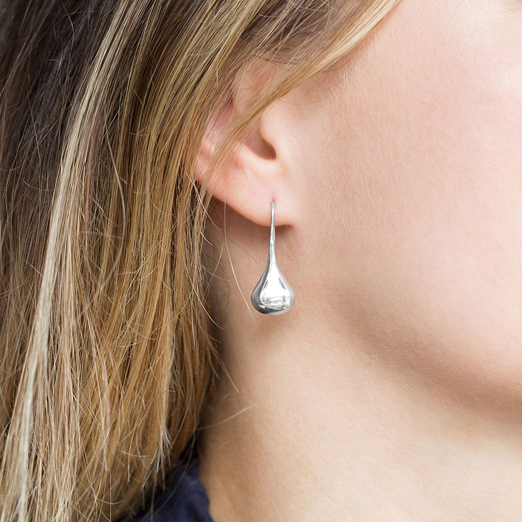 Polished Raindrop Earrings On Ear