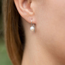 White Freshwater Pearl Earrings On Ear